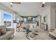 Bright living room with direct view into kitchen and dining areas, with an open concept layout at 326 129Th E Ave, Madeira Beach, FL 33708