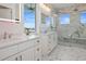 Main bathroom featuring double vanity, spacious shower, and modern fixtures at 326 129Th E Ave, Madeira Beach, FL 33708