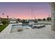 Beautiful waterfront pool area including seating and boat dock, ideal for enjoying the outdoors at 326 129Th E Ave, Madeira Beach, FL 33708