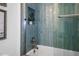 Close up of tiled shower featuring blue tiling and silver hardware at 326 129Th E Ave, Madeira Beach, FL 33708