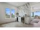 Wet bar featuring wine fridge, white cabinets, marble accent wall and natural light at 326 129Th E Ave, Madeira Beach, FL 33708