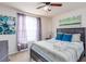 Bright bedroom with a large window, comfortable bed, and stylish decor creating a relaxing space at 4101 W Nassau St, Tampa, FL 33607