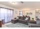 Open-concept living space with a comfortable sectional and dining area at 4101 W Nassau St, Tampa, FL 33607