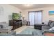 Comfortable living room featuring a plush sofa and a large television at 4101 W Nassau St, Tampa, FL 33607