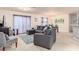 Spacious living area featuring a sectional sofa and abundant natural light at 4101 W Nassau St, Tampa, FL 33607