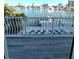 Balcony view of a waterfront with clear water, docks, and neighborhood homes at 460 137Th Avenue Cir, Madeira Beach, FL 33708