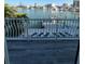 Balcony with lounge chairs and marina view in waterfront property at 460 137Th Avenue Cir, Madeira Beach, FL 33708
