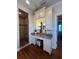 Bathroom vanity with custom cabinets and glass enclosed shower at 460 137Th Avenue Cir, Madeira Beach, FL 33708