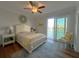 Serene bedroom featuring waterfront views, a sliding glass door to the balcony and relaxing decor and furnishings at 460 137Th Avenue Cir, Madeira Beach, FL 33708