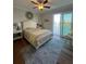 Bedroom with waterfront views and access to a balcony, featuring a comfortable bed and calming decor at 460 137Th Avenue Cir, Madeira Beach, FL 33708
