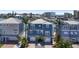 Attractive blue home featuring a double garage, well-kept lawn, and nearby water views in a desirable location at 460 137Th Avenue Cir, Madeira Beach, FL 33708