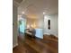 Hallway featuring a bench with hardwood floors and a view of the home's entry and hallway at 460 137Th Avenue Cir, Madeira Beach, FL 33708