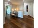 Hallway boasts gleaming hardwood floors, a cozy bench, and an ornate wrought iron accent over the door at 460 137Th Avenue Cir, Madeira Beach, FL 33708