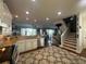 Open-concept kitchen with granite countertops, stainless steel appliances, and seamless flow to the living area at 460 137Th Avenue Cir, Madeira Beach, FL 33708