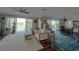 Living room with water views and modern decor at 460 137Th Avenue Cir, Madeira Beach, FL 33708