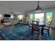 Bright living room with wood floors and ocean views at 460 137Th Avenue Cir, Madeira Beach, FL 33708