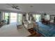 Living room with water views and modern decor at 460 137Th Avenue Cir, Madeira Beach, FL 33708