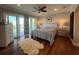 Beautiful primary bedroom with hardwood floors and water views at 460 137Th Avenue Cir, Madeira Beach, FL 33708