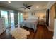 Beautiful primary bedroom with hardwood floors and water views at 460 137Th Avenue Cir, Madeira Beach, FL 33708