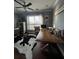Office with a large desk, hardwood floors and an abundance of natural light at 460 137Th Avenue Cir, Madeira Beach, FL 33708