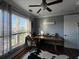 Office with desk, hardwood floors and an abundance of natural light at 460 137Th Avenue Cir, Madeira Beach, FL 33708