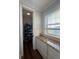 Pantry includes granite countertops, updated cabinets, and storage racks for optimal organization and accessibility at 460 137Th Avenue Cir, Madeira Beach, FL 33708