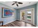 Bright sitting area with serene water views from French doors and unique artwork at 460 137Th Avenue Cir, Madeira Beach, FL 33708