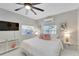 Bright bedroom with a king bed, TV, and windows at 4753 48Th N Ave, St Petersburg, FL 33714