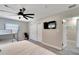 Bright bedroom with a large bed, a bunk bed, a TV, and an ensuite bathroom at 4753 48Th N Ave, St Petersburg, FL 33714