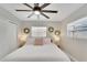 Bright bedroom with natural light, ceiling fan and decorative mirrors at 4753 48Th N Ave, St Petersburg, FL 33714