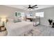 Bright bedroom with queen size bed, bunk beds and overhead fan at 4753 48Th N Ave, St Petersburg, FL 33714