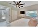 Bedroom featuring a king bed, TV, and outdoor access at 4753 48Th N Ave, St Petersburg, FL 33714
