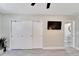 Bedroom with large closet, television and adjacent hallway at 4753 48Th N Ave, St Petersburg, FL 33714