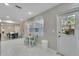 Eat-in kitchen with white cabinets, modern appliances, and an abundance of natural light at 4753 48Th N Ave, St Petersburg, FL 33714