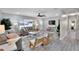 Well-lit living room with wood flooring, neutral tones, and comfortable seating at 4753 48Th N Ave, St Petersburg, FL 33714