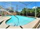 Beautiful in-ground pool with a diving board and a screened-in patio for outdoor enjoyment at 4753 48Th N Ave, St Petersburg, FL 33714