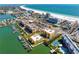 Stunning aerial view of beachfront condos, a pristine beach, and the Gulf of Mexico at 5353 Gulf Blvd # B103, St Pete Beach, FL 33706