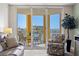 Enjoy waterfront views from your private balcony with comfortable seating and serene ambiance at 5353 Gulf Blvd # B103, St Pete Beach, FL 33706