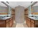 This bathroom offers dual vanities and a mosaic tile shower at 5353 Gulf Blvd # B103, St Pete Beach, FL 33706