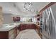 Gourmet kitchen with granite countertops, stainless steel appliances, and wine refrigerator at 5353 Gulf Blvd # B103, St Pete Beach, FL 33706