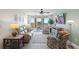 Relaxing living room with comfortable seating, stylish decor, and access to the private balcony at 5353 Gulf Blvd # B103, St Pete Beach, FL 33706