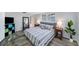 Comfortable bedroom with a queen sized bed, natural light, and stylish decor at 5910 River Rd, New Port Richey, FL 34652