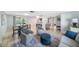 Open-concept living area featuring comfortable seating, a dining area, and a seamless flow to the outdoor space at 5910 River Rd, New Port Richey, FL 34652