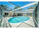 Enclosed pool area provides a refreshing outdoor retreat and is perfect for entertaining at 5910 River Rd, New Port Richey, FL 34652