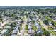 Sprawling aerial view of a residential area showcasing tree-lined streets and neatly arranged single-Gathering homes at 5931 33 N Ave, St Petersburg, FL 33710