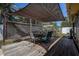 Relaxing backyard patio with shade cover perfect for entertaining and relaxation at 5931 33 N Ave, St Petersburg, FL 33710
