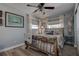 Cozy bedroom with a comfortable bed, nice decorations, and curtains at 5931 33 N Ave, St Petersburg, FL 33710