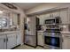 Modern kitchen with stainless steel appliances and ample counter space at 5931 33 N Ave, St Petersburg, FL 33710