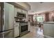 Charming kitchen with stainless steel appliances and adjacent dining area filled with light at 5931 33 N Ave, St Petersburg, FL 33710