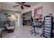 Comfortable living room with tile floors, a ceiling fan, and a view into another room at 5931 33 N Ave, St Petersburg, FL 33710